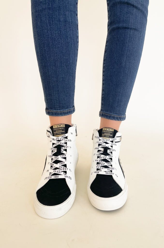 The Vintage Havana Gadol High Top Sneaker is just "WOW"!! It has so many incredible details that make this sneaker stand out. This style has a classic high top shape, star studs along the sides, and a black suede contrast on the front. It is an all out cool-girl shoe. 