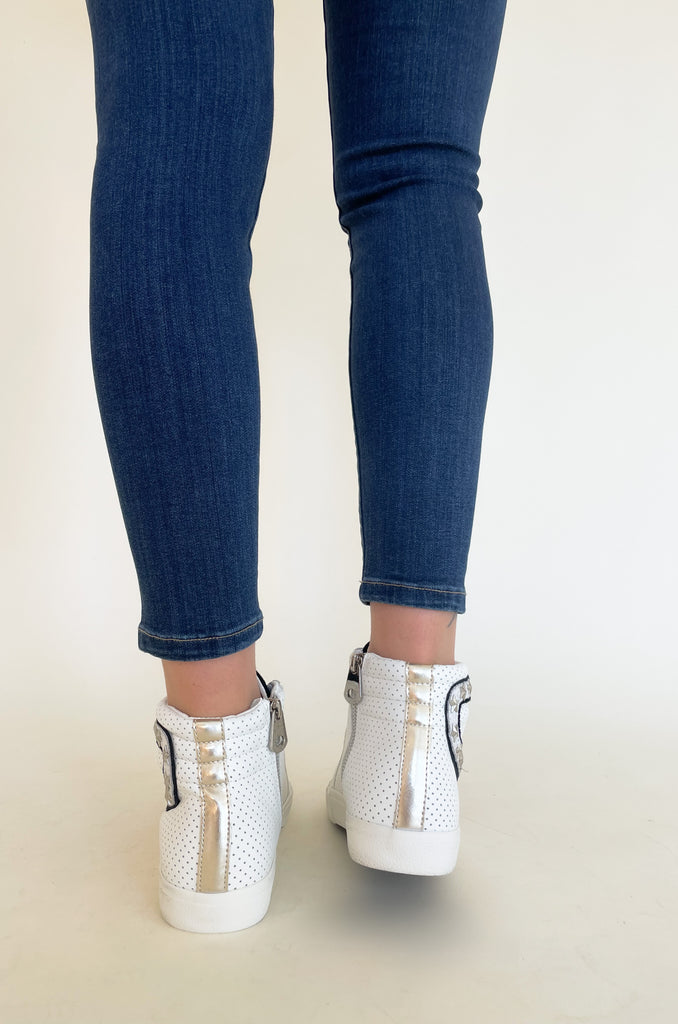 The Vintage Havana Gadol High Top Sneaker is just "WOW"!! It has so many incredible details that make this sneaker stand out. This style has a classic high top shape, star studs along the sides, and a black suede contrast on the front. It is an all out cool-girl shoe. 