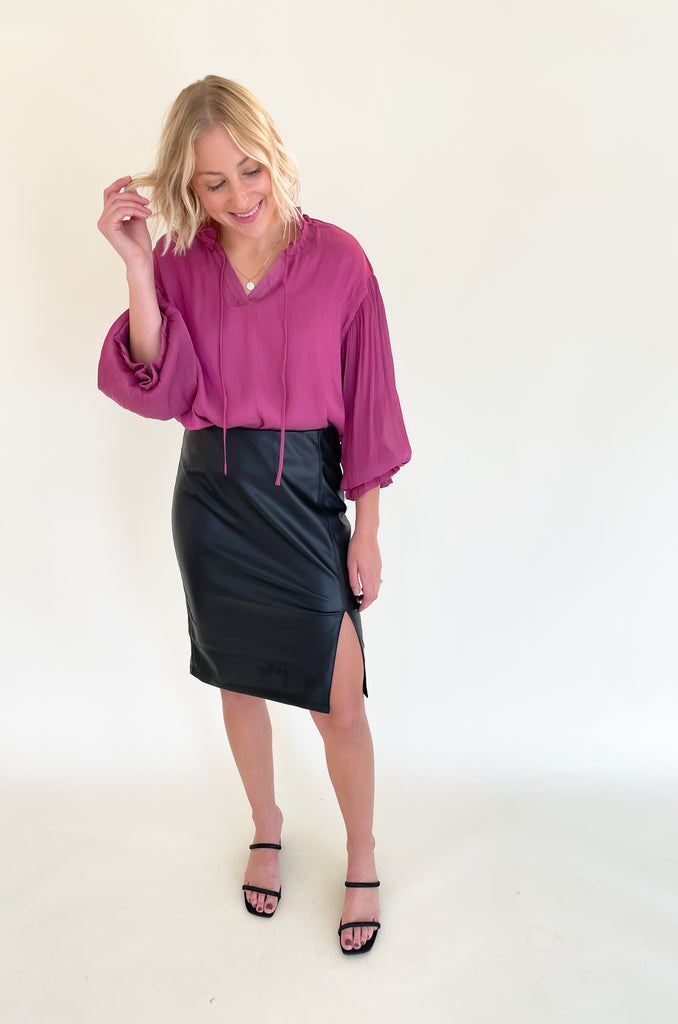 The Liverpool  black Pencil Skirt with 23.5" slit is so elevated and chic. This is the perfect work or date night skirt, and pairs beautifully with so many tops. We styled it with our new voluminous blouse for a fun look! 