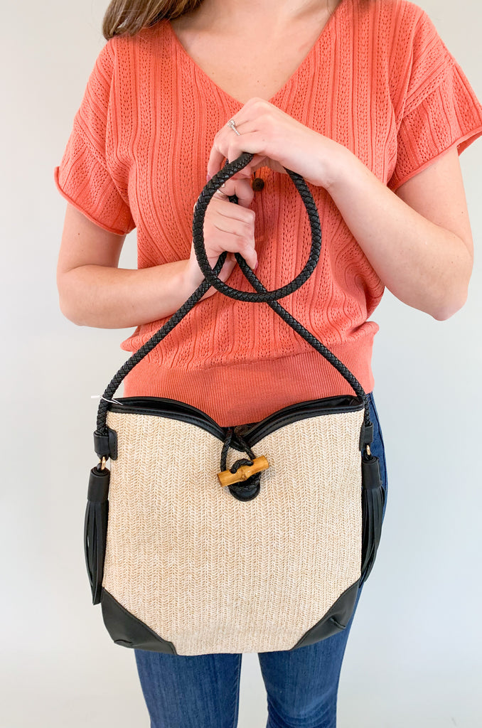 The Vonnie Straw Crossbody with Toggle Fastening is the perfect summer bag! The straw detail is so fun- and a hot trend we are seeing in handbags right now. Add the black and it becomes a very wearable look. You can pair this purse with so many outfits for an elevated style. 