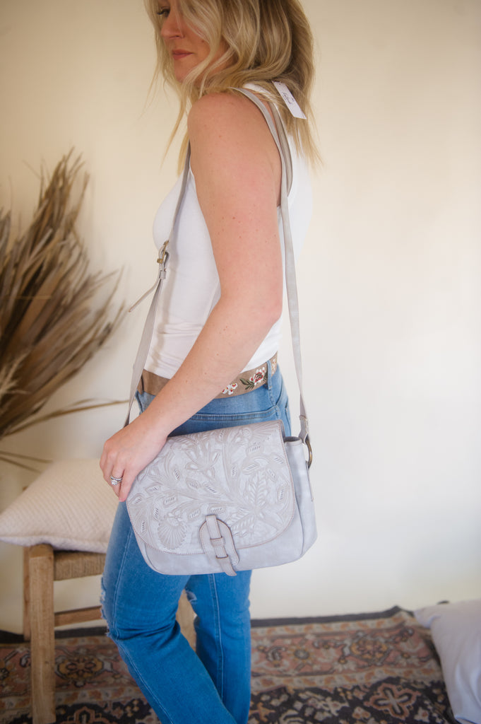 The Wildflower Saddle Handtooled Leather Crossbody is the perfect all year round bag. It has the western influence that we love, but is also very wearable. We love the color too! It will go with everything.