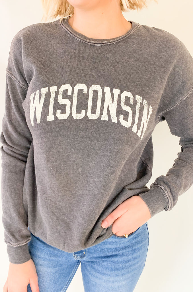 Wisconsin fans, get ready to fall in love with this dreamy pullover! It is so soft and cozy, perfect for weekends, game days, class, you name it. We are loving the unique mineral washed effect too. It makes each pullover slightly unique with a vintage feel. Choose between to cute colors!