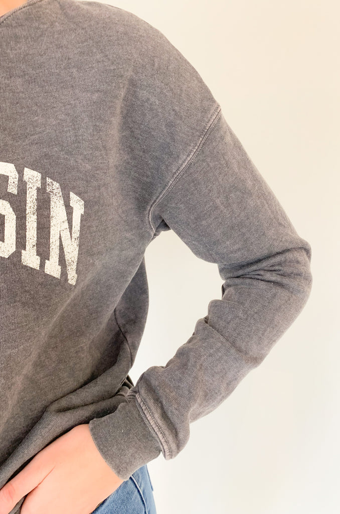 Wisconsin fans, get ready to fall in love with this dreamy pullover! It is so soft and cozy, perfect for weekends, game days, class, you name it. We are loving the unique mineral washed effect too. It makes each pullover slightly unique with a vintage feel. Choose between to cute colors!