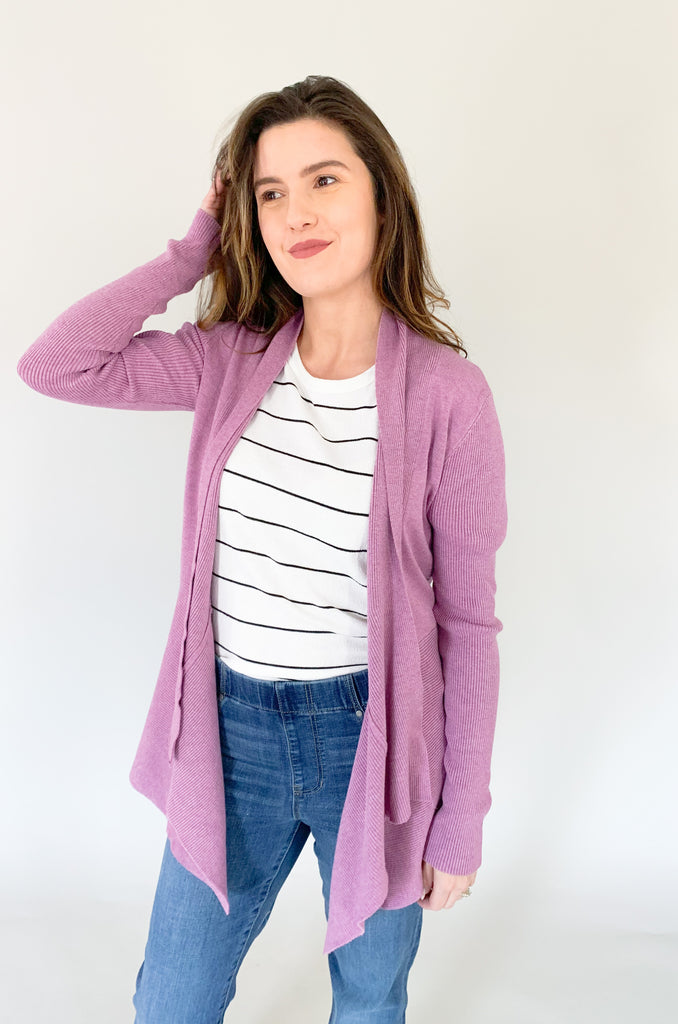 The Witney Waterfall Ribbed Cardigan is so soft and stretchy, just like our other bestselling dreamers cardigans. This style is a dusty purple color with unique ribbing on the sides. It is more fitted in the arms with a flowy body and waterfall open front. We paired it with our new Danny Boxy Top for a fun look. 