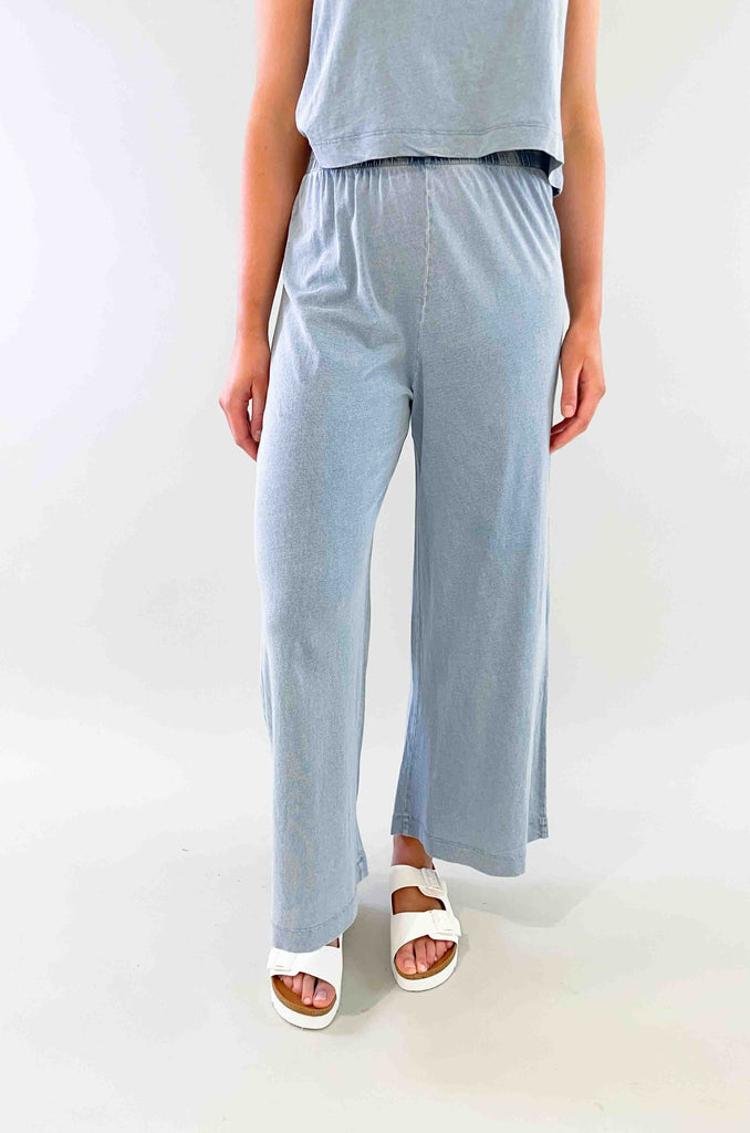 You need at least one good lightweight spring pant! These Scout Jersey Flare Pants are made with a 100% cotton jersey knit fabric and features a trendy flare cropped silhouette with an elastic waistband. The Scout Pant is a relaxed but stylish piece that matches perfectly with the Sloane Cotton Jersey Tank. Washed denim colored elastic waist pant